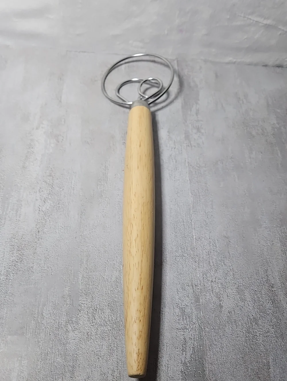 Long Danish dough whisk features a distinctive 